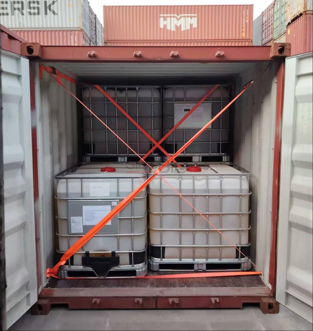 2‑Butoxyethanol IBC totes secured inside shipping container for ocean export.png